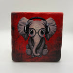 Illustration of an elephant printed on square travertine stone coaster