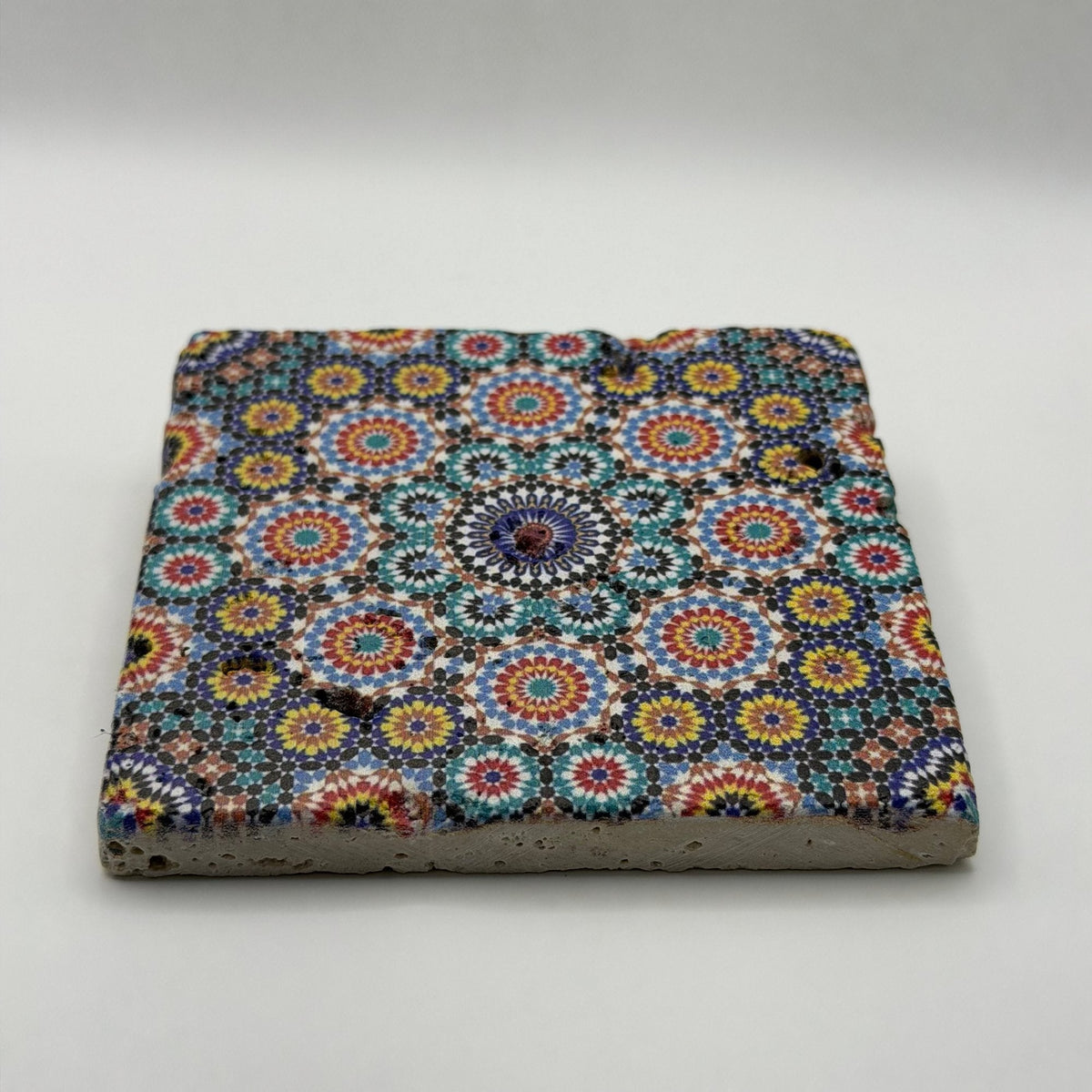 Ethnics pattern number 03 printed on a natural travertine stone coaster