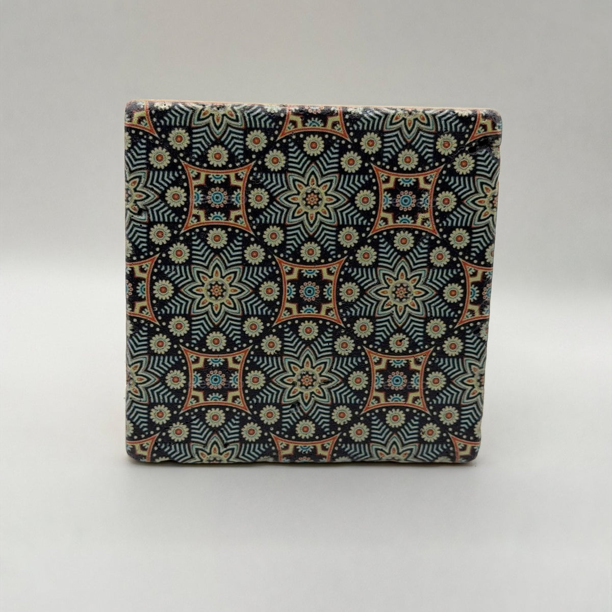 Ethnics pattern number 04 printed on a natural travertine stone coaster