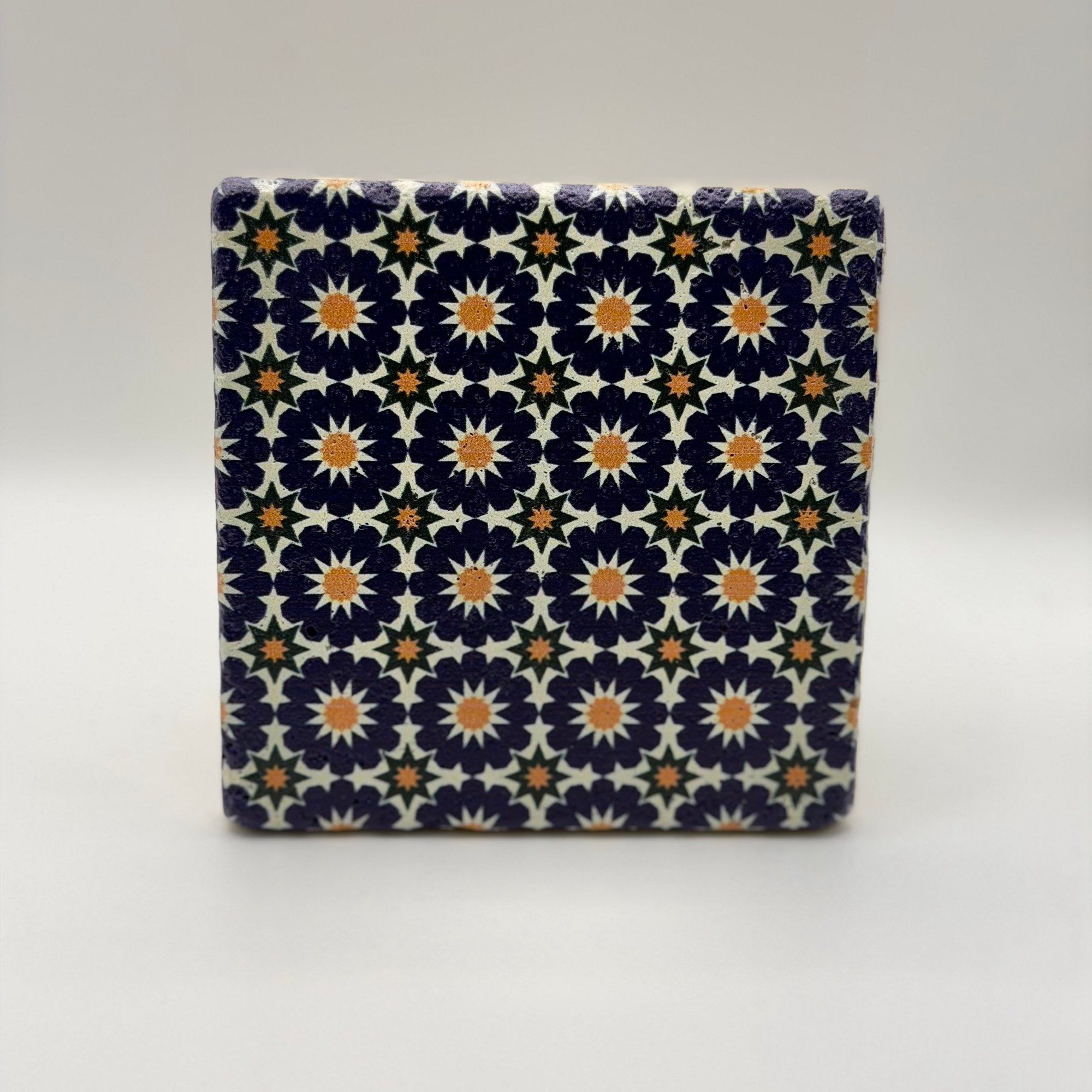 Ethnics pattern number 12 printed on a natural travertine stone coaster