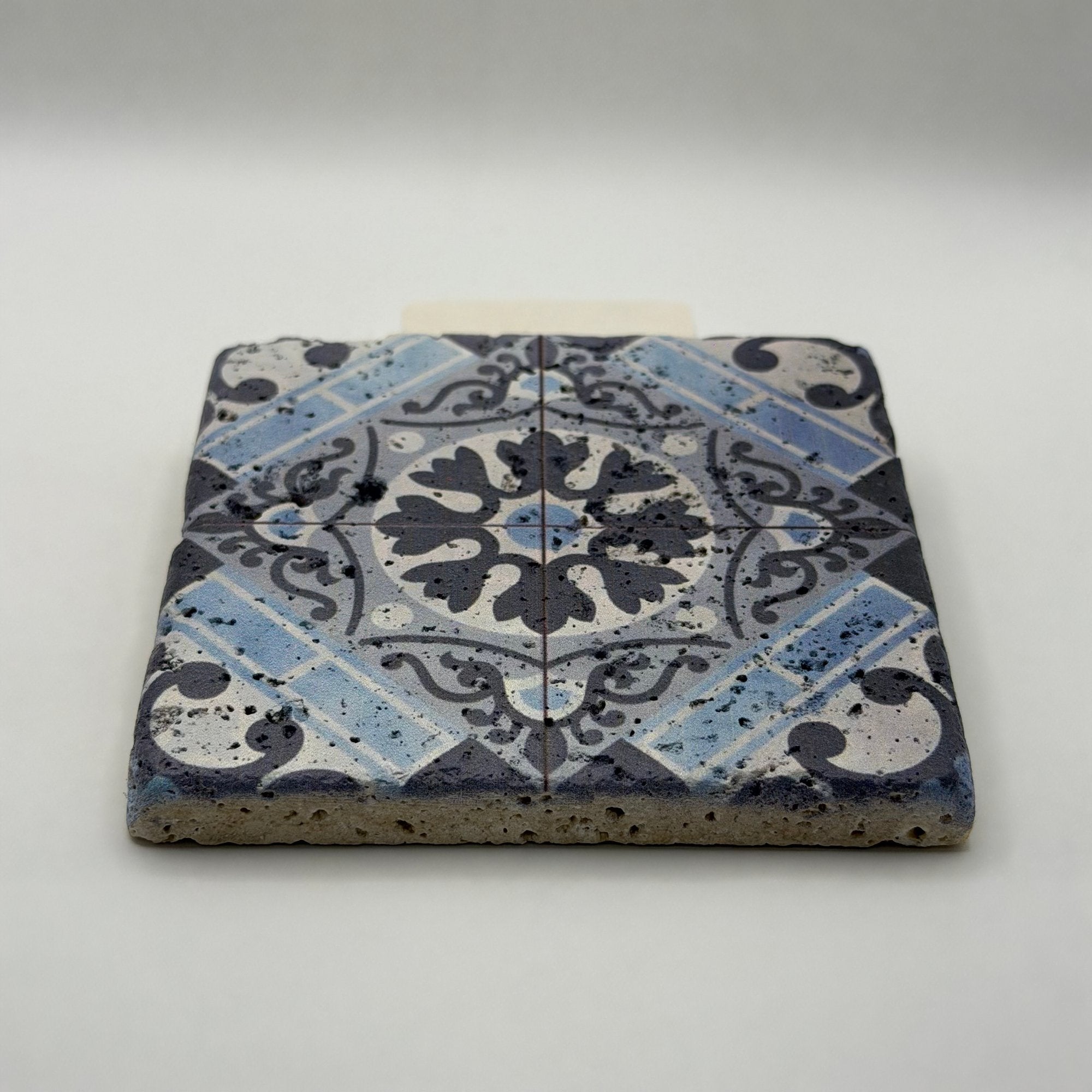 Ethnics pattern number 13 printed on a natural travertine stone coaster