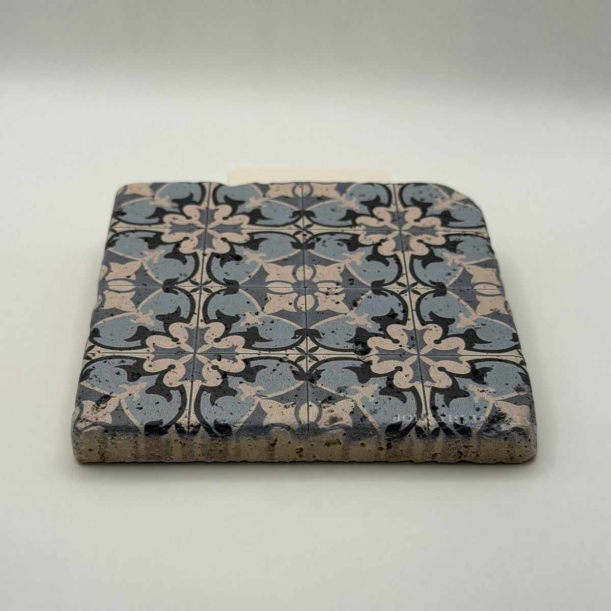 Ethnics pattern number 14 printed on a natural travertine stone coaster
