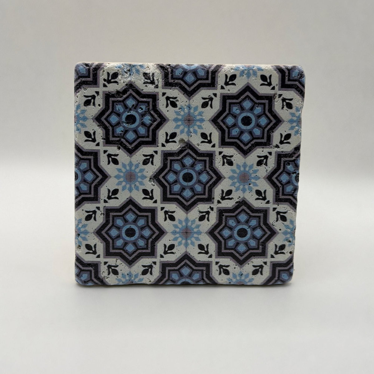 Ethnics pattern number 15 printed on a natural travertine stone coaster