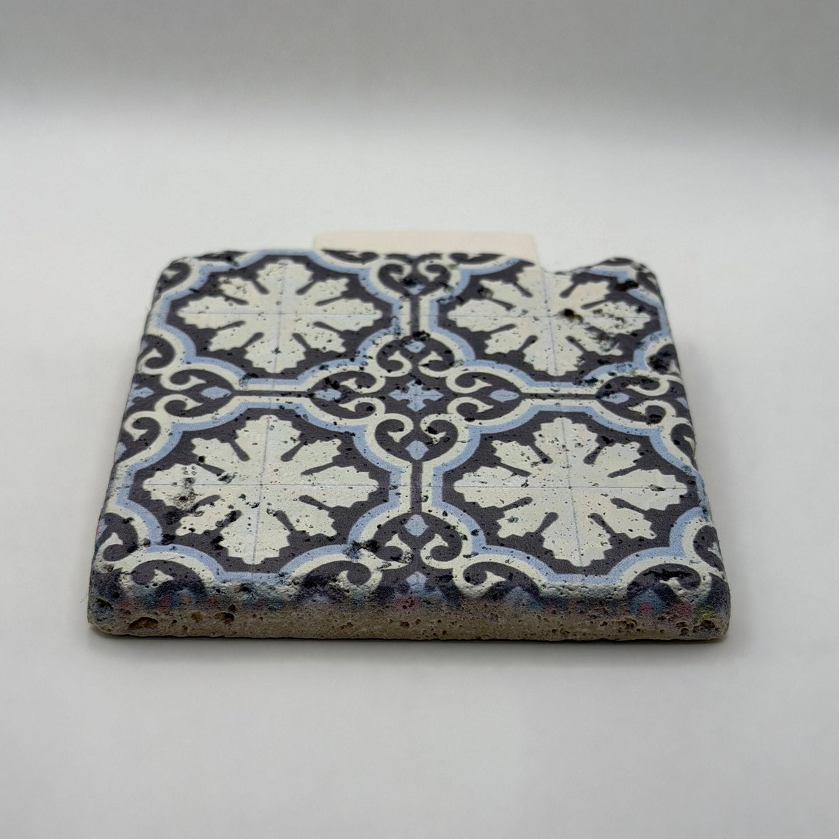 Ethnics pattern number 16 printed on a natural travertine stone coaster