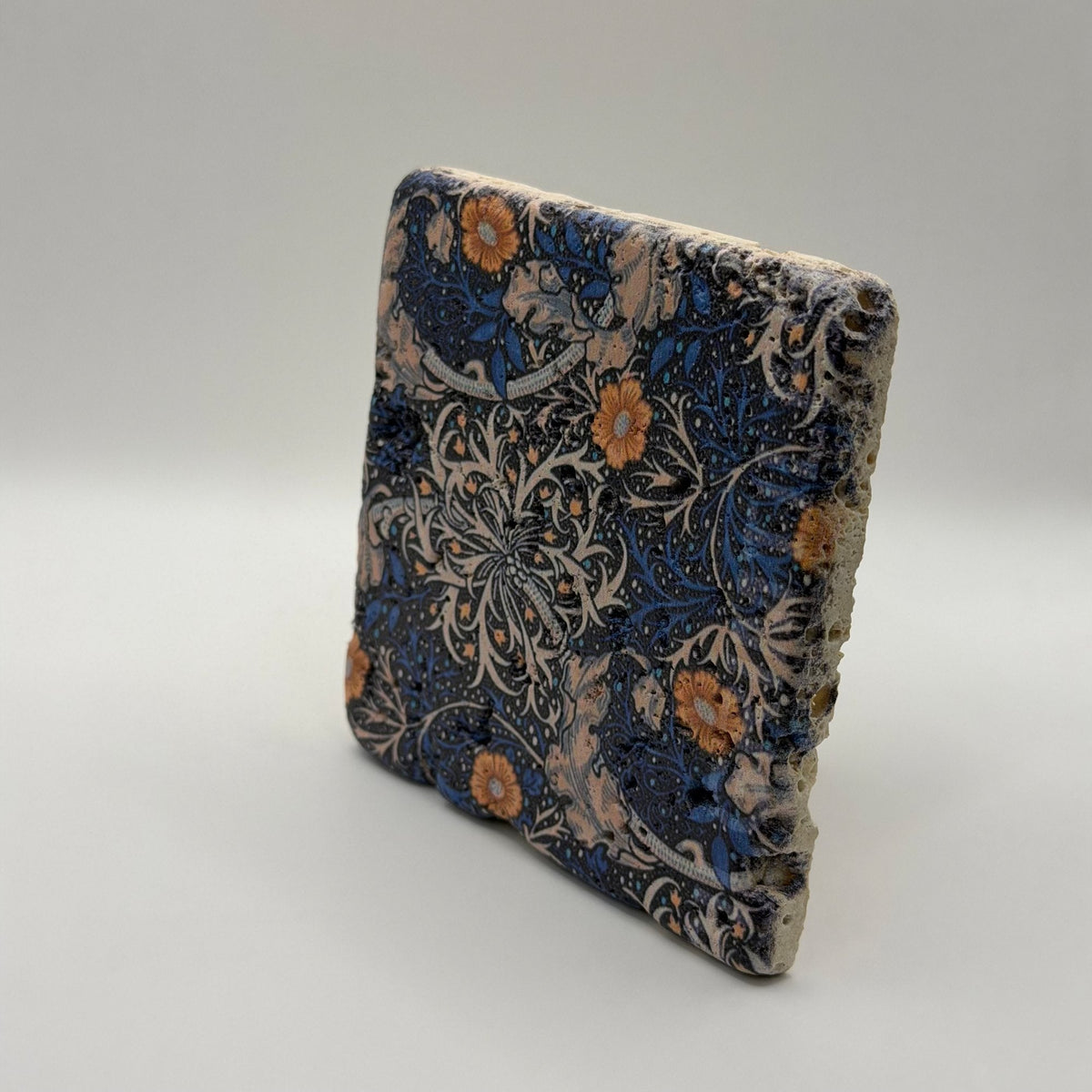 Ethnics pattern number 17 printed on a natural travertine stone coaster