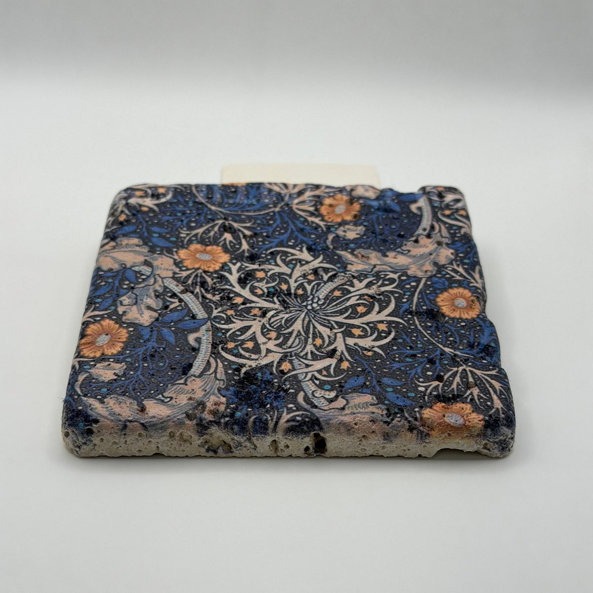 Ethnics pattern number 17 printed on a natural travertine stone coaster