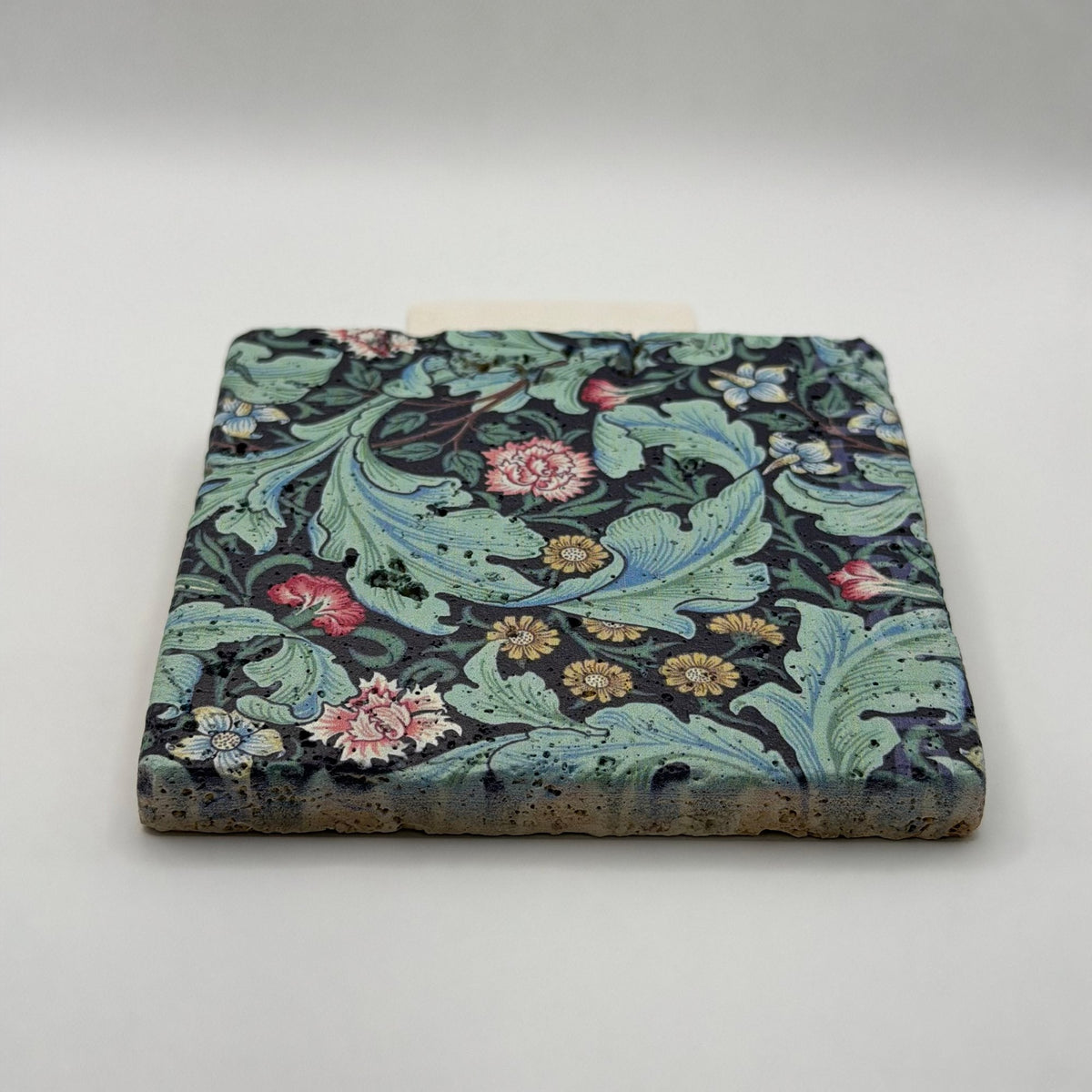 Ethnics pattern number 18 printed on a natural travertine stone coaster