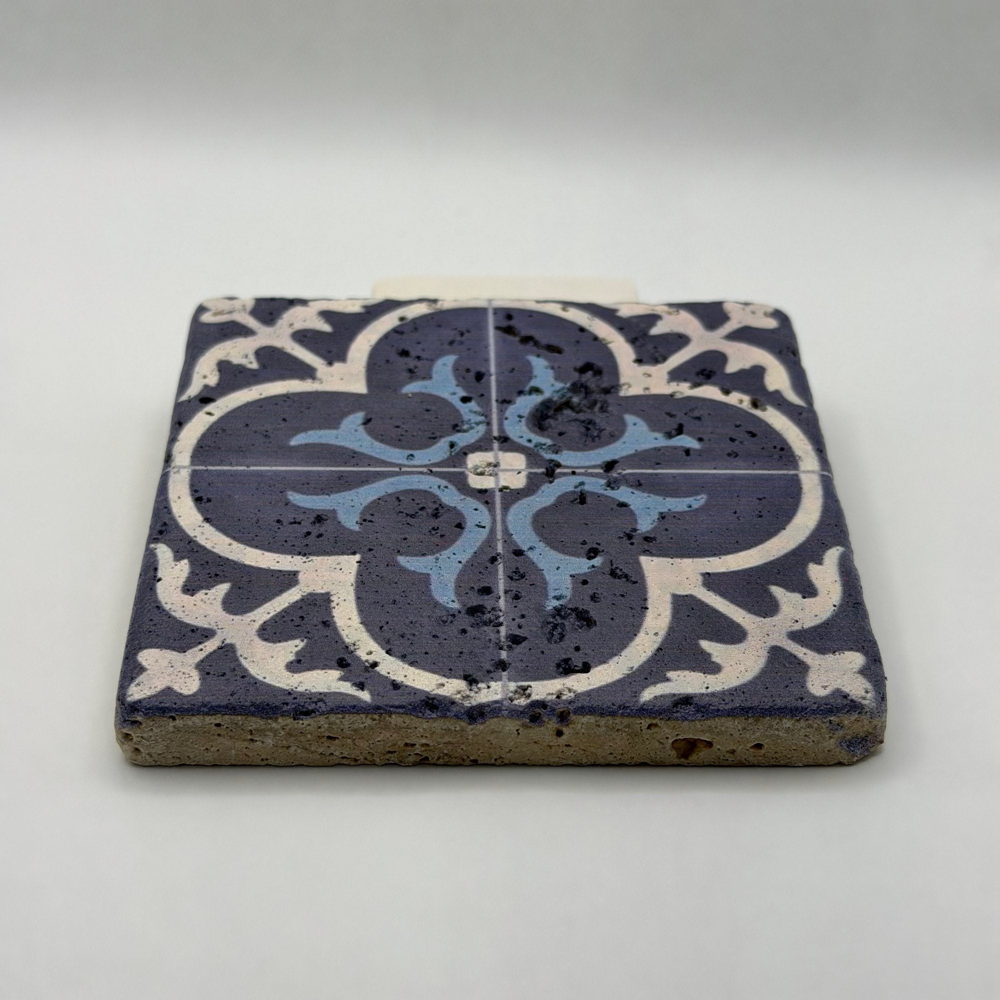Ethnics pattern number 19 printed on a natural travertine stone coaster
