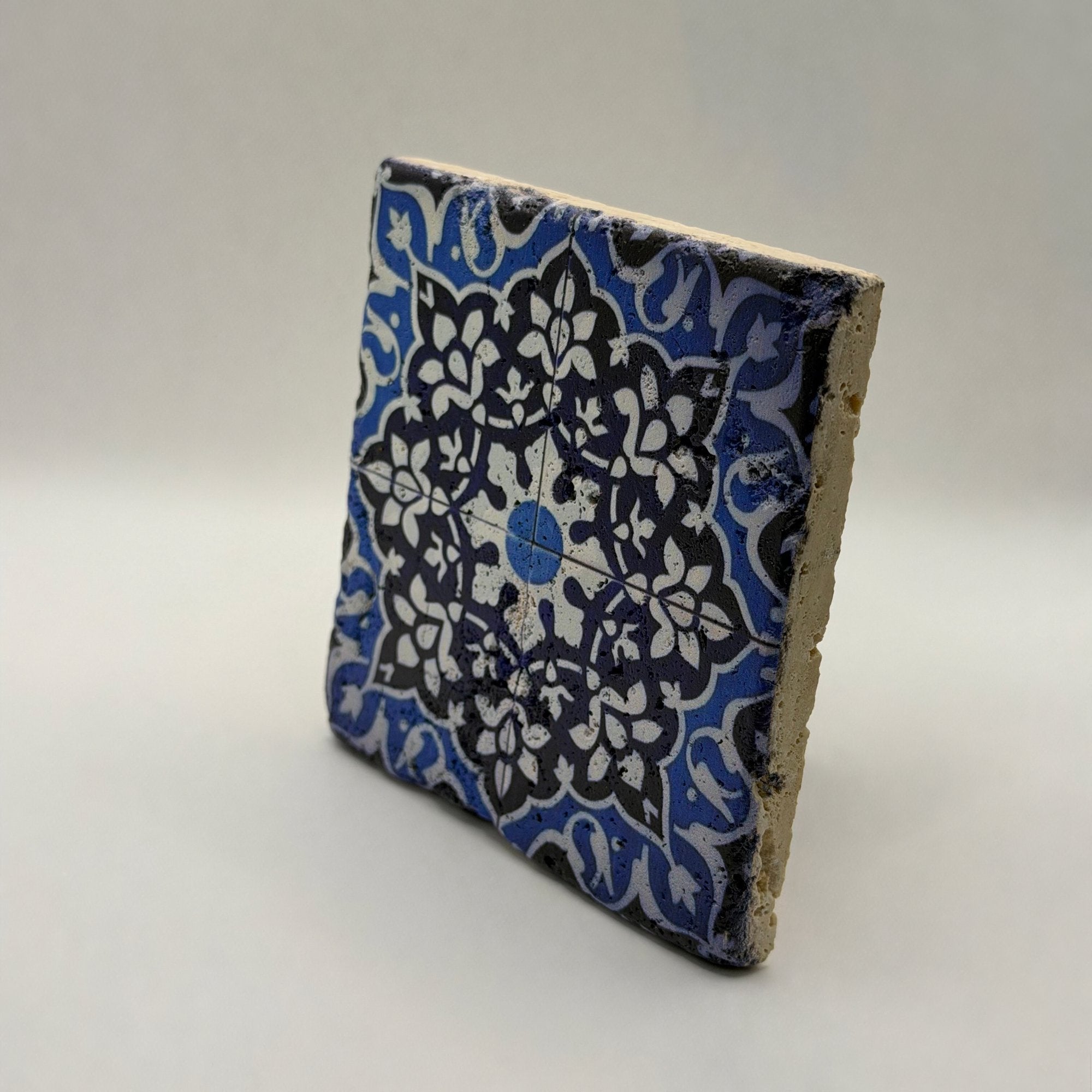Ethnics pattern number 21 printed on a natural travertine stone coaster