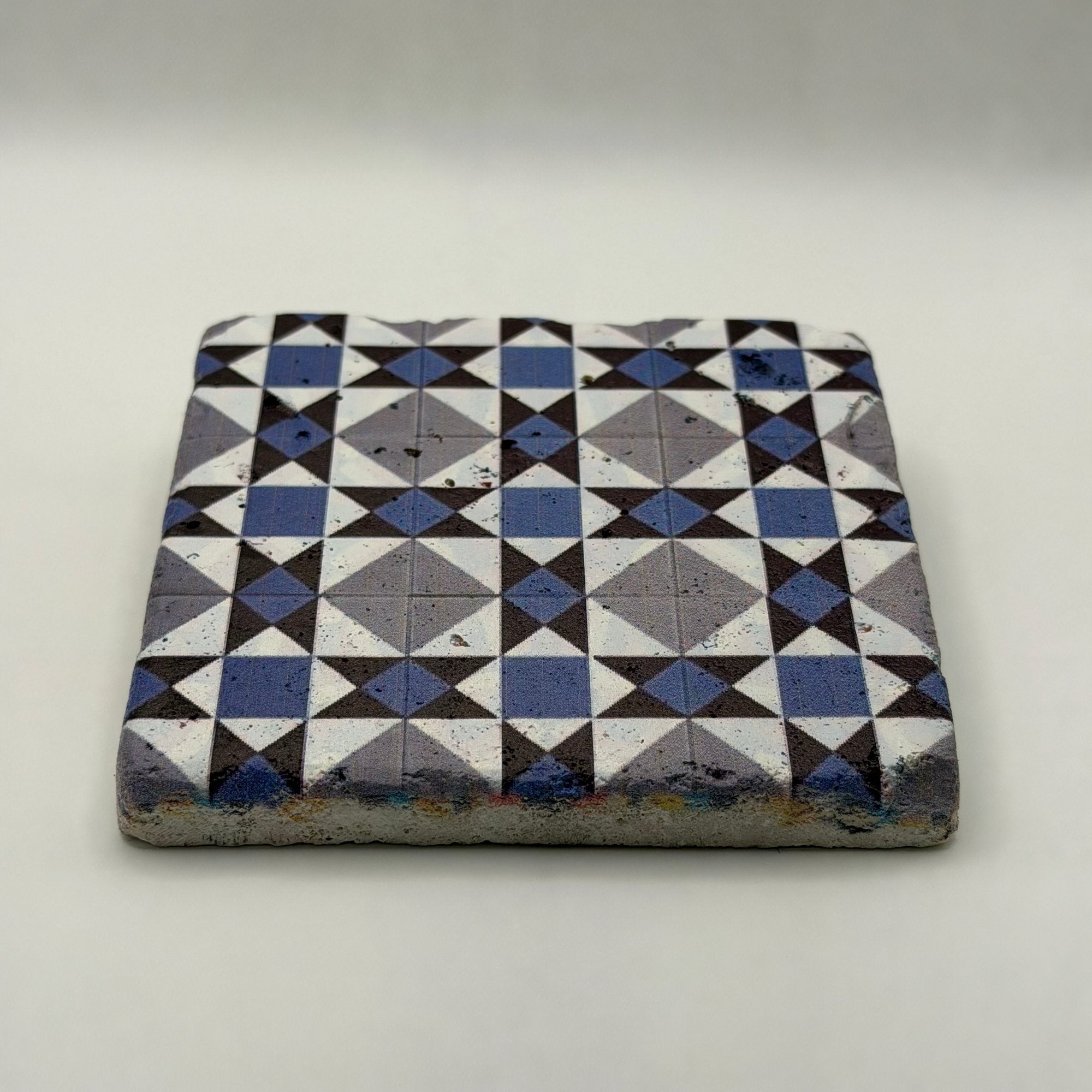 Ethnics pattern number 23 printed on a natural travertine stone coaster