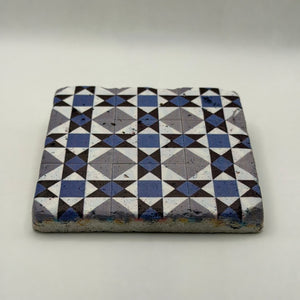 Ethnics pattern number 23 printed on a natural travertine stone coaster