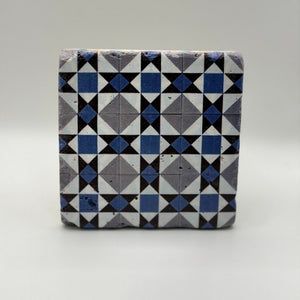 Ethnics pattern number 23 printed on a natural travertine stone coaster