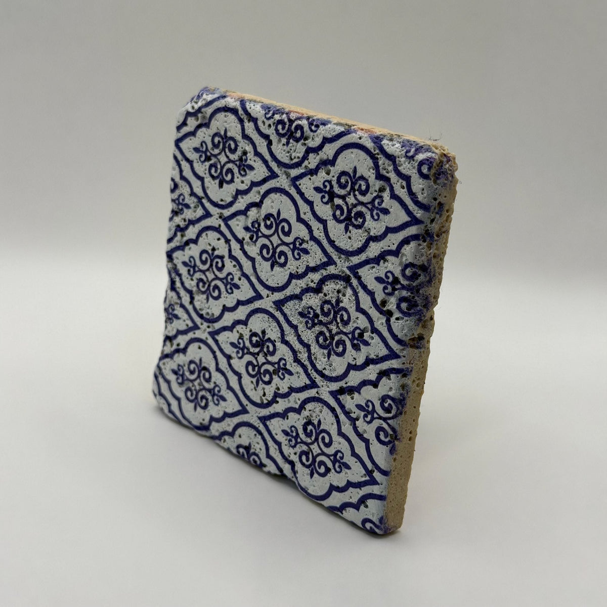 Ethnics pattern number 24 printed on a natural travertine stone coaster
