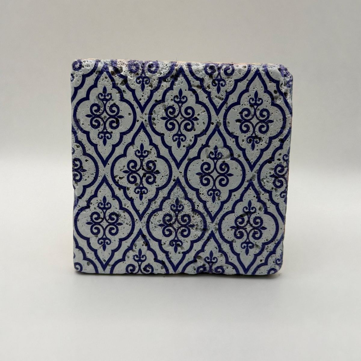 Ethnics pattern number 24 printed on a natural travertine stone coaster