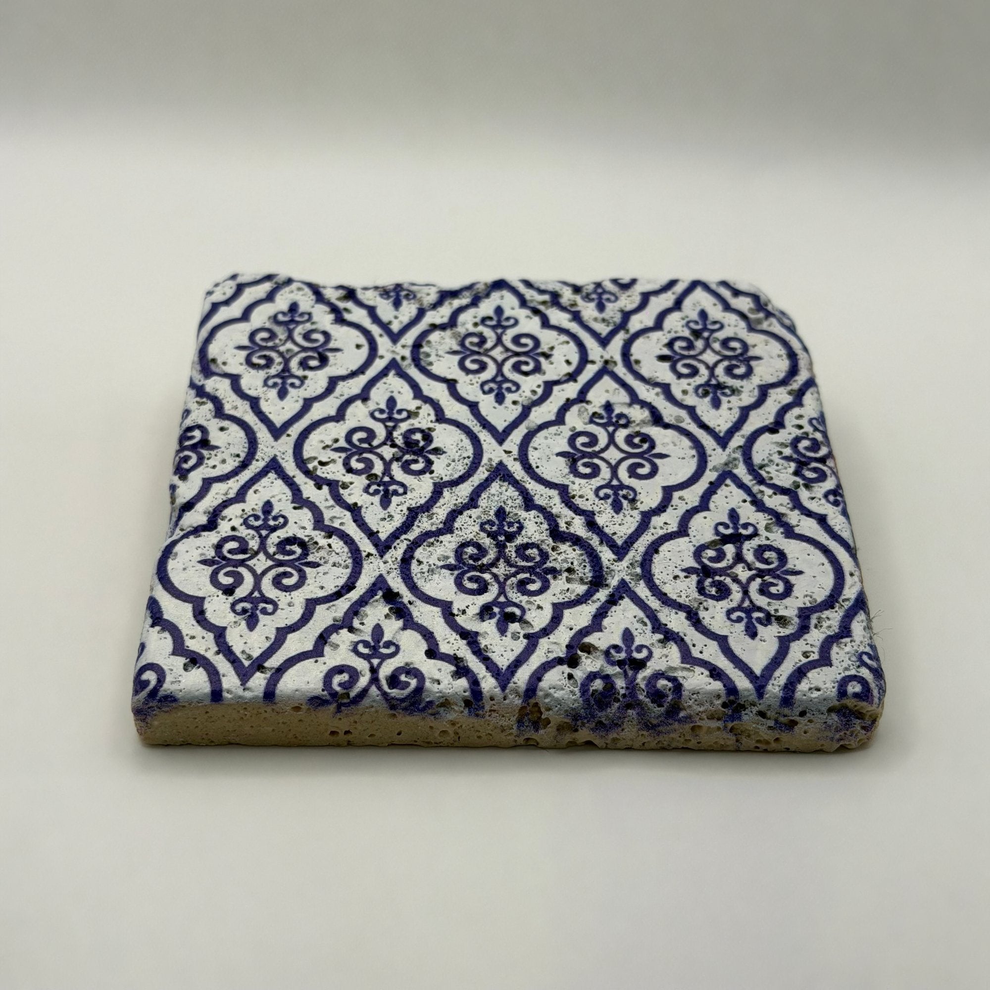 Ethnics pattern number 24 printed on a natural travertine stone coaster