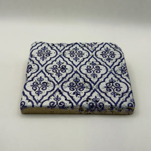 Ethnics pattern number 24 printed on a natural travertine stone coaster