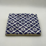 Ethnics pattern number 25 printed on a natural travertine stone coaster