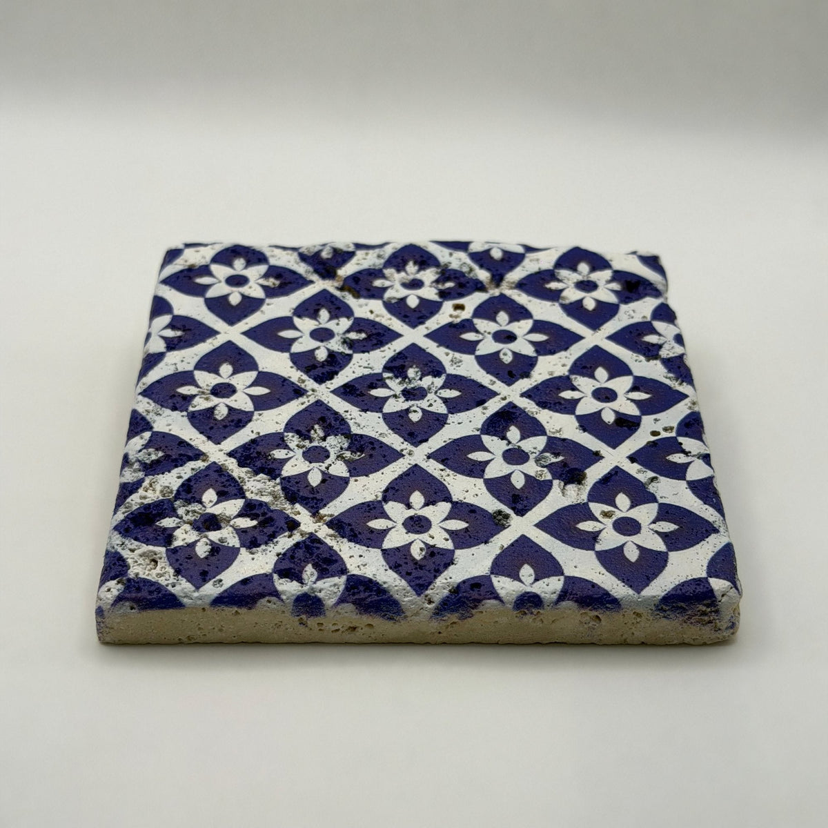 Ethnics pattern number 25 printed on a natural travertine stone coaster