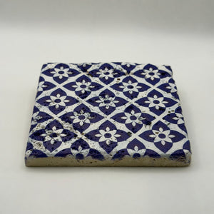 Ethnics pattern number 25 printed on a natural travertine stone coaster