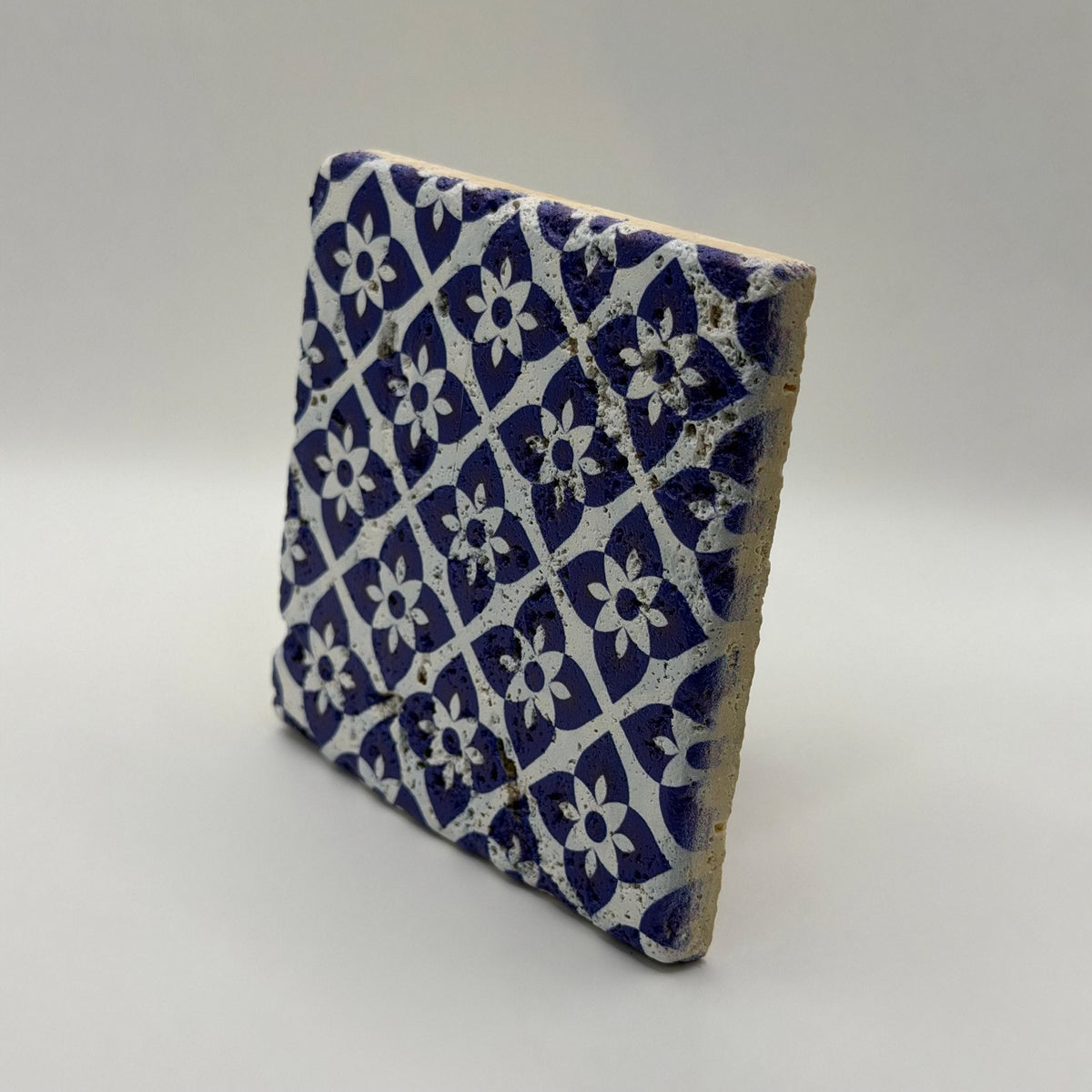 Ethnics pattern number 25 printed on a natural travertine stone coaster