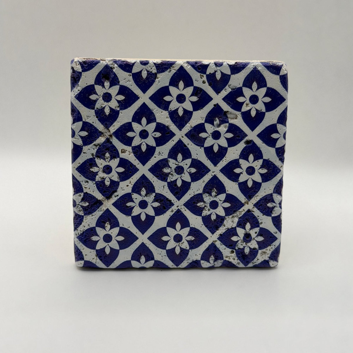 Ethnics pattern number 25 printed on a natural travertine stone coaster