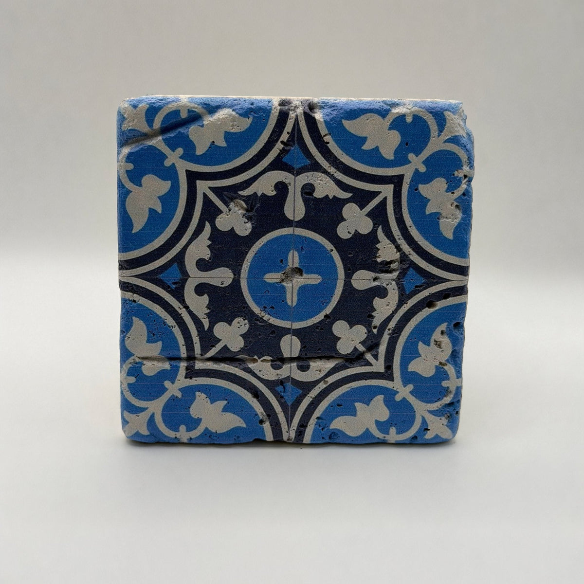 Ethnics pattern number 27 printed on a natural travertine stone coaster