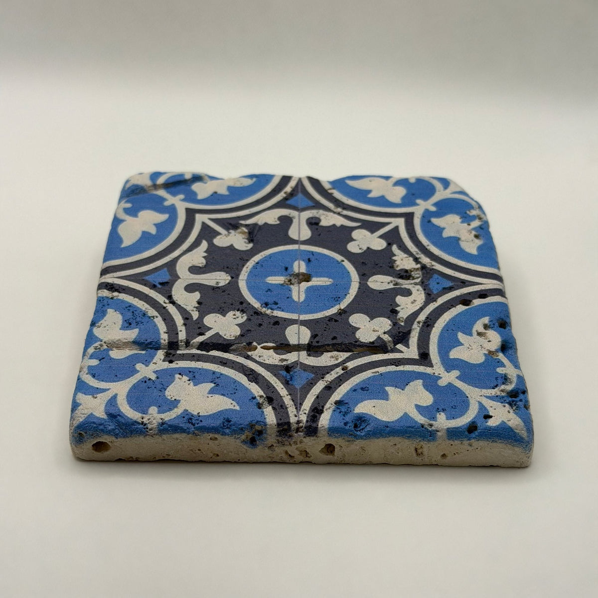 Ethnics pattern number 27 printed on a natural travertine stone coaster
