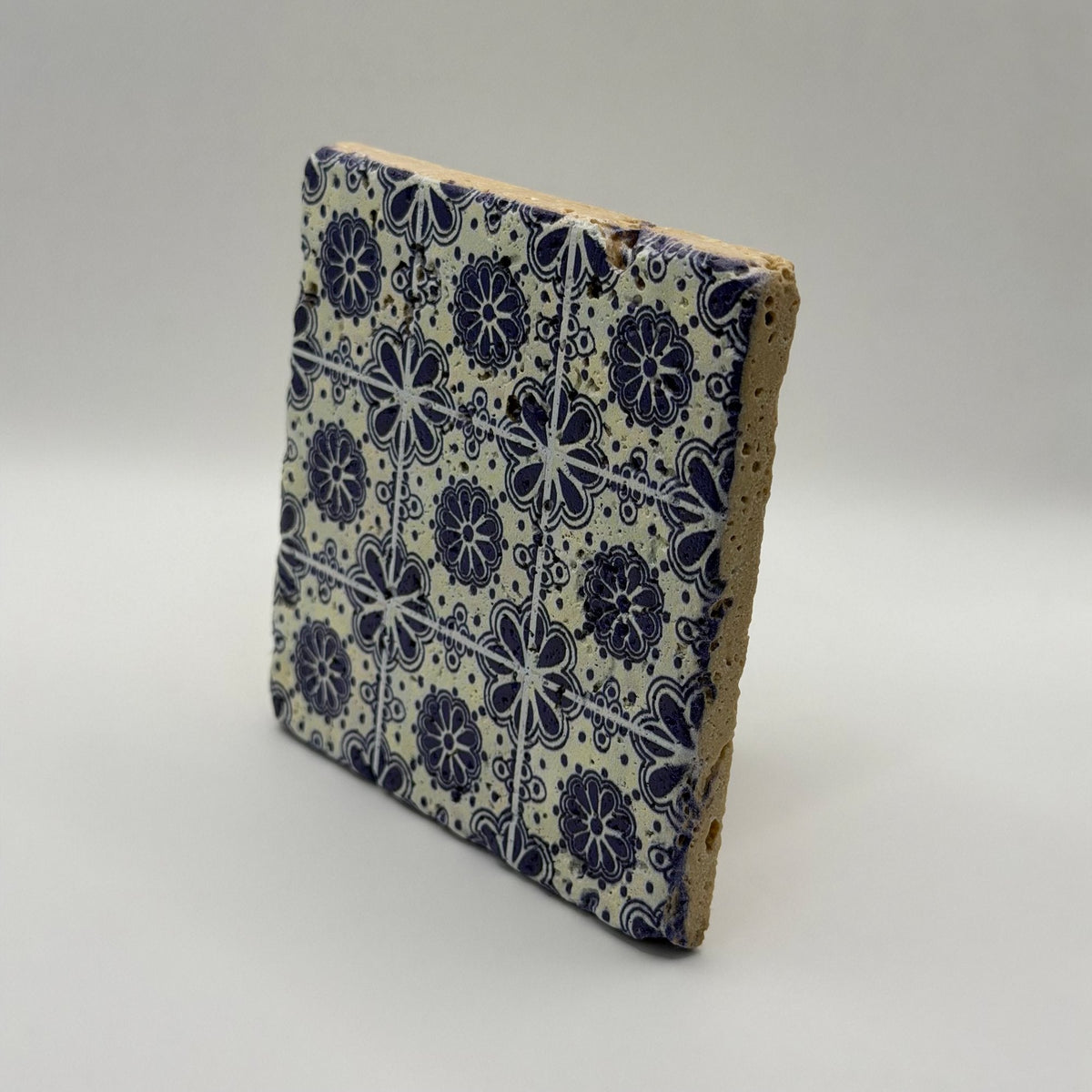 Ethnics pattern number 28 printed on a natural travertine stone coaster