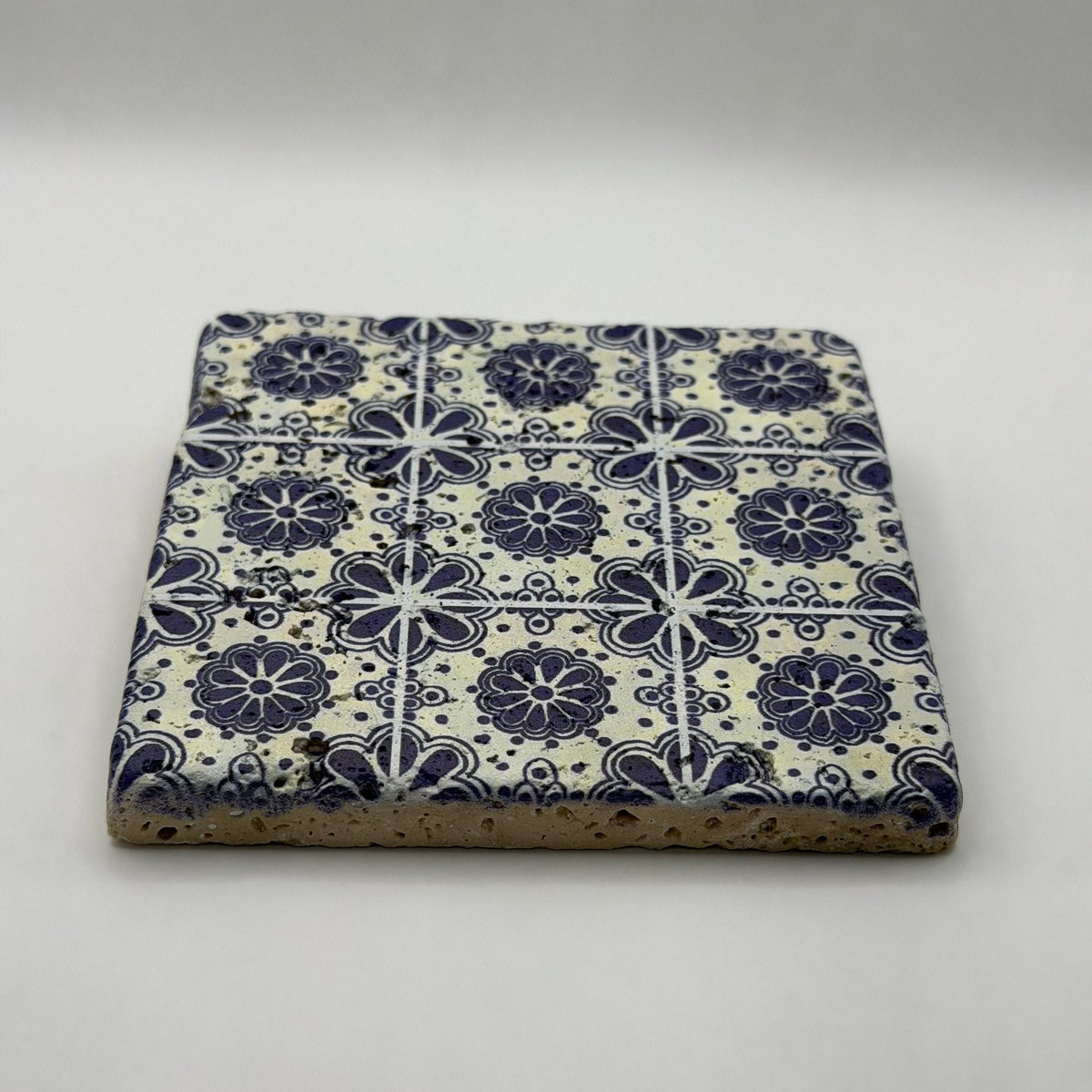 Ethnics pattern number 28 printed on a natural travertine stone coaster