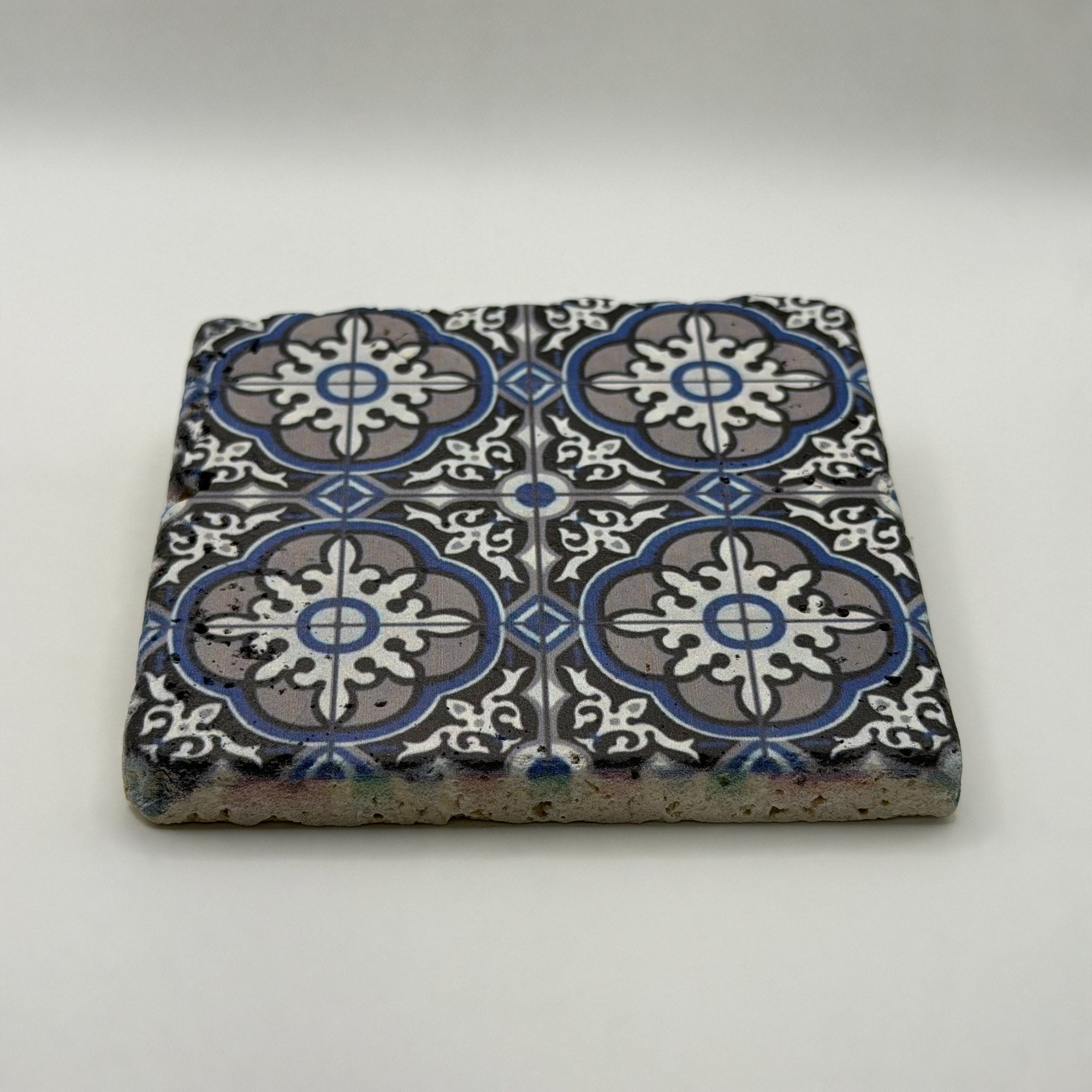 Ethnics pattern number 30 printed on a natural travertine stone coaster