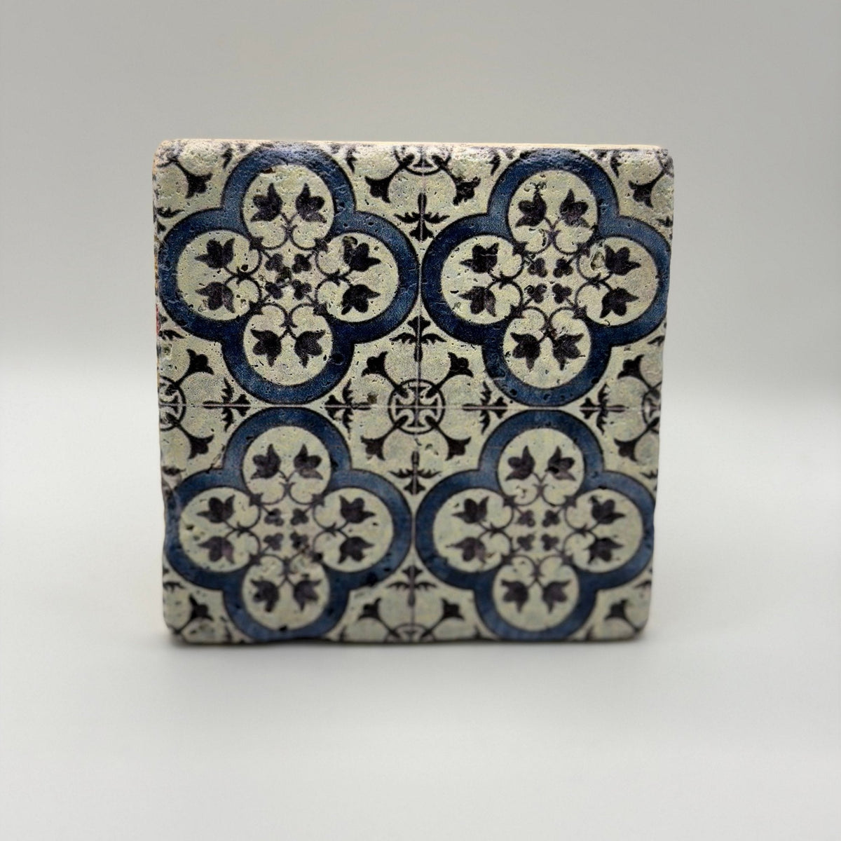 Ethnics pattern number 31 printed on a natural travertine stone coaster