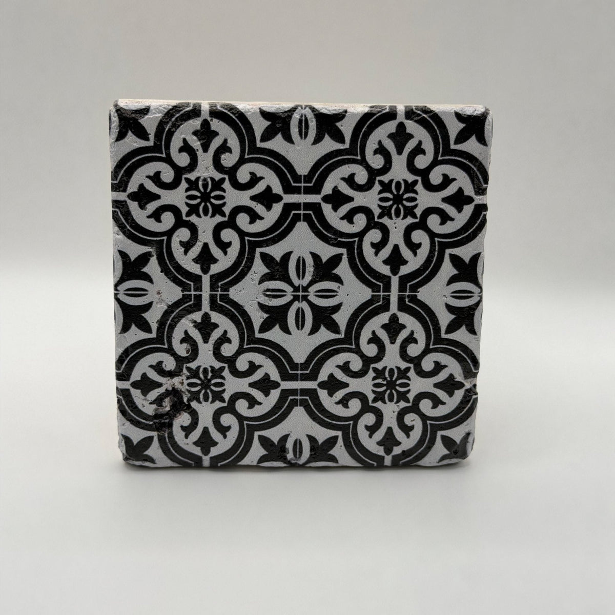 Ethnics pattern number 32 printed on a natural travertine stone coaster