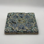 Ethnics pattern number 33 printed on a natural travertine stone coaster