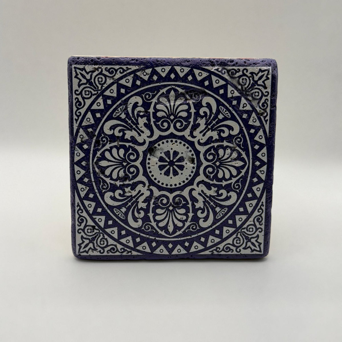 Ethnics pattern number 34 printed on a natural travertine stone coaster