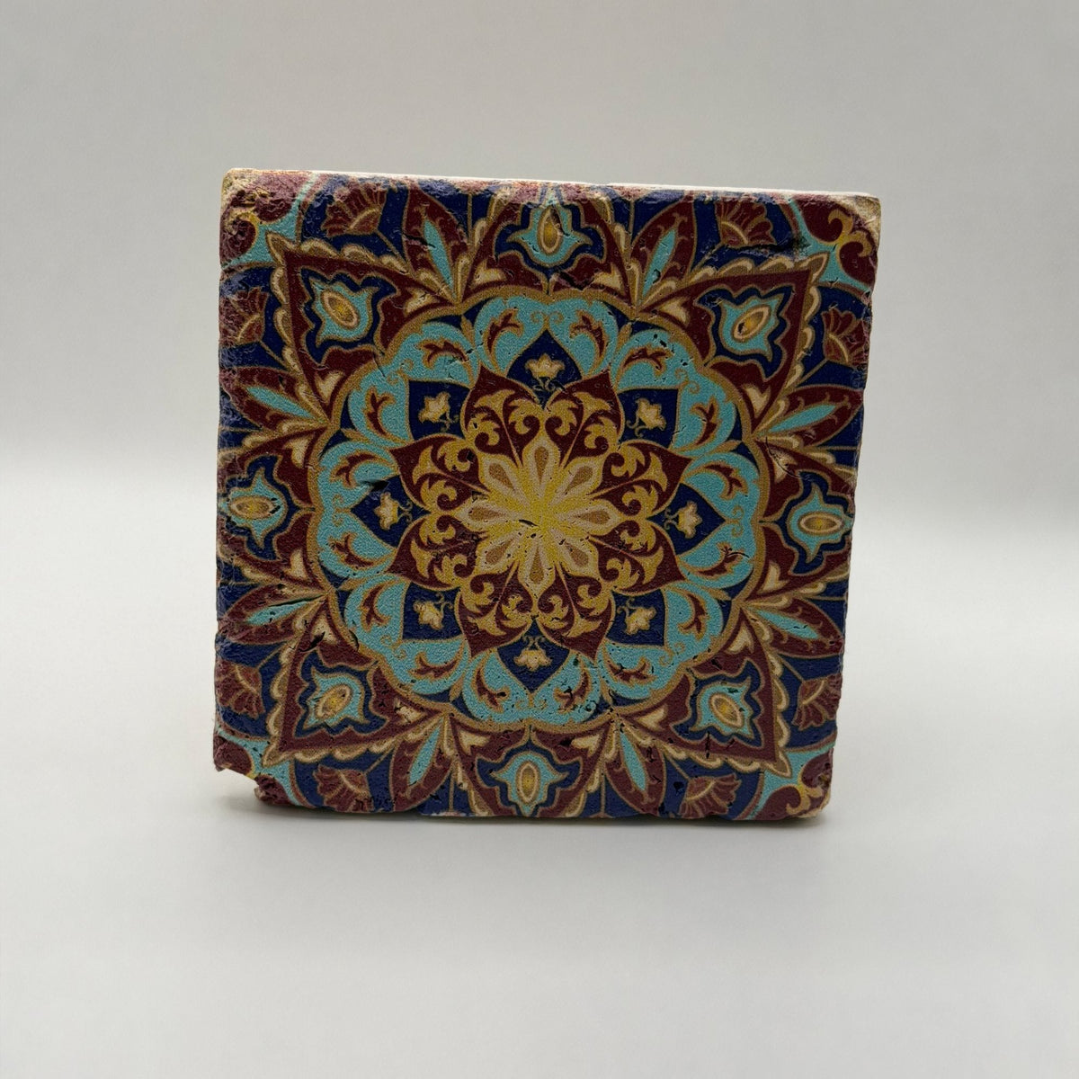 Ethnics pattern number 35 printed on a natural travertine stone coaster
