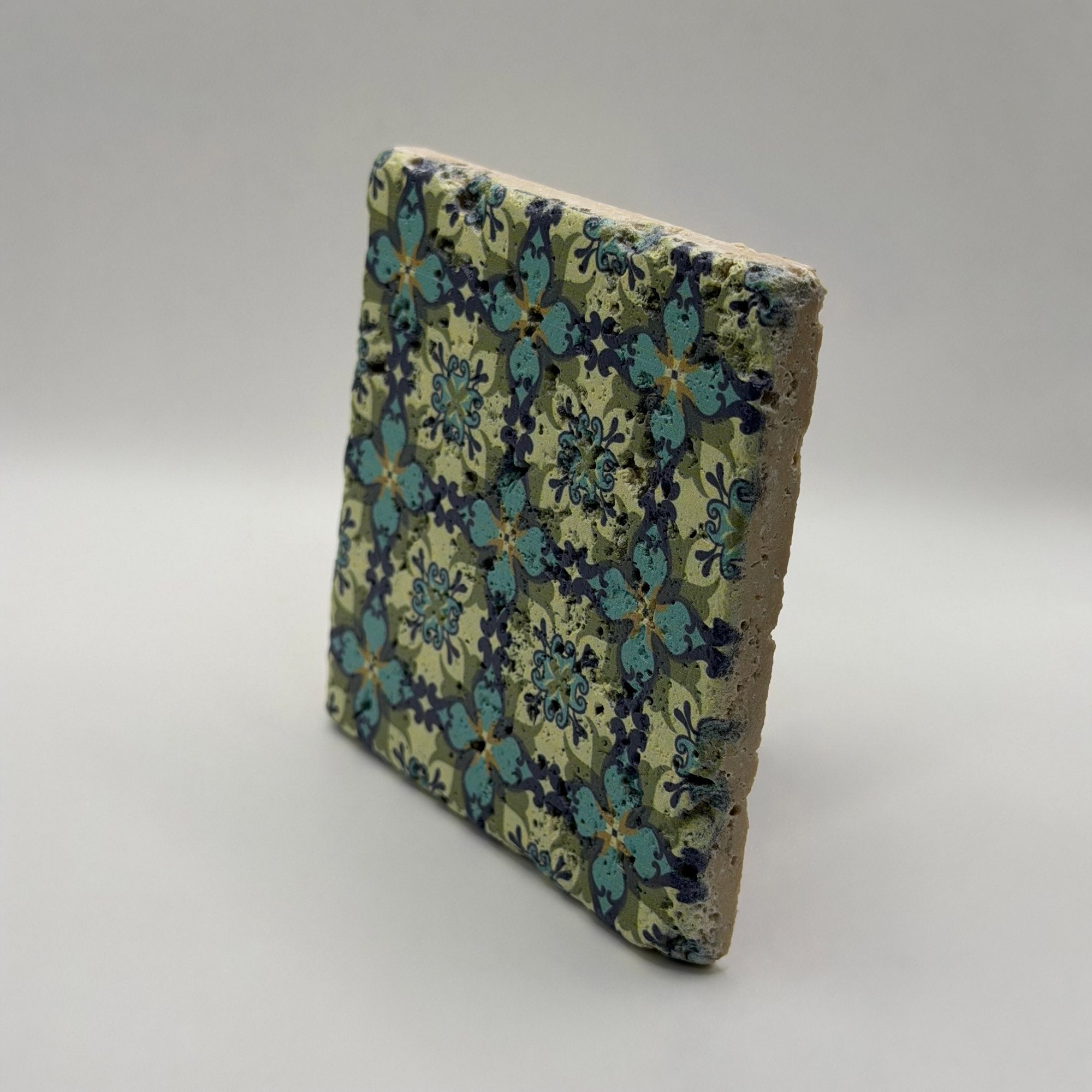 Ethnics pattern number 36 printed on a natural travertine stone coaster
