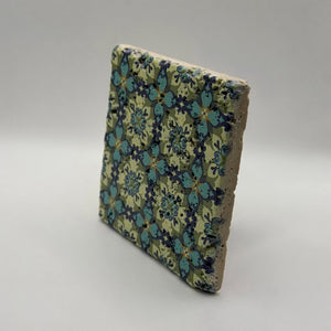 Ethnics pattern number 36 printed on a natural travertine stone coaster