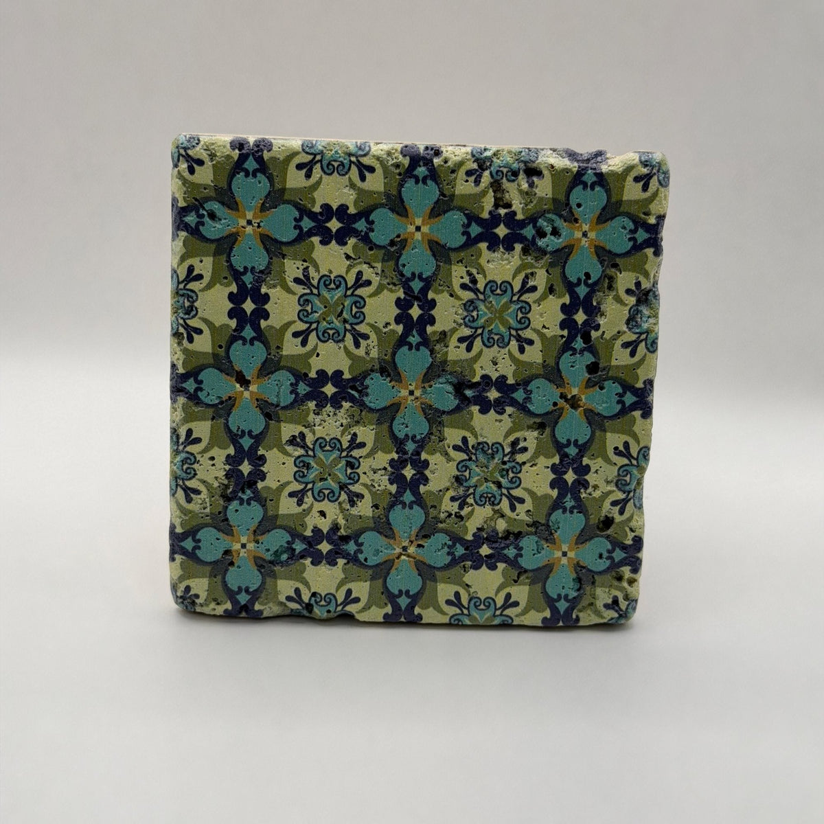 Ethnics pattern number 36 printed on a natural travertine stone coaster