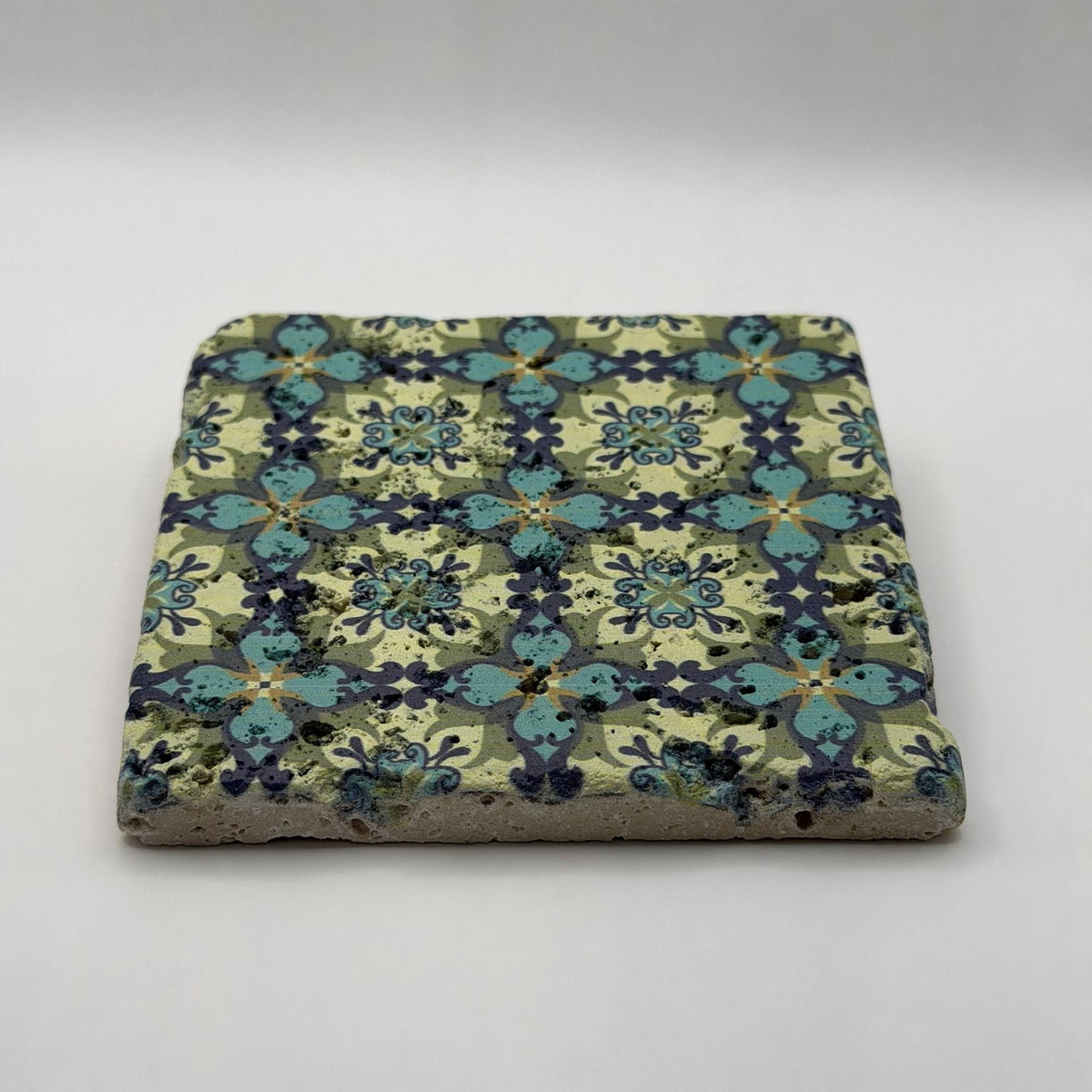 Ethnics pattern number 36 printed on a natural travertine stone coaster