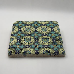 Ethnics pattern number 36 printed on a natural travertine stone coaster