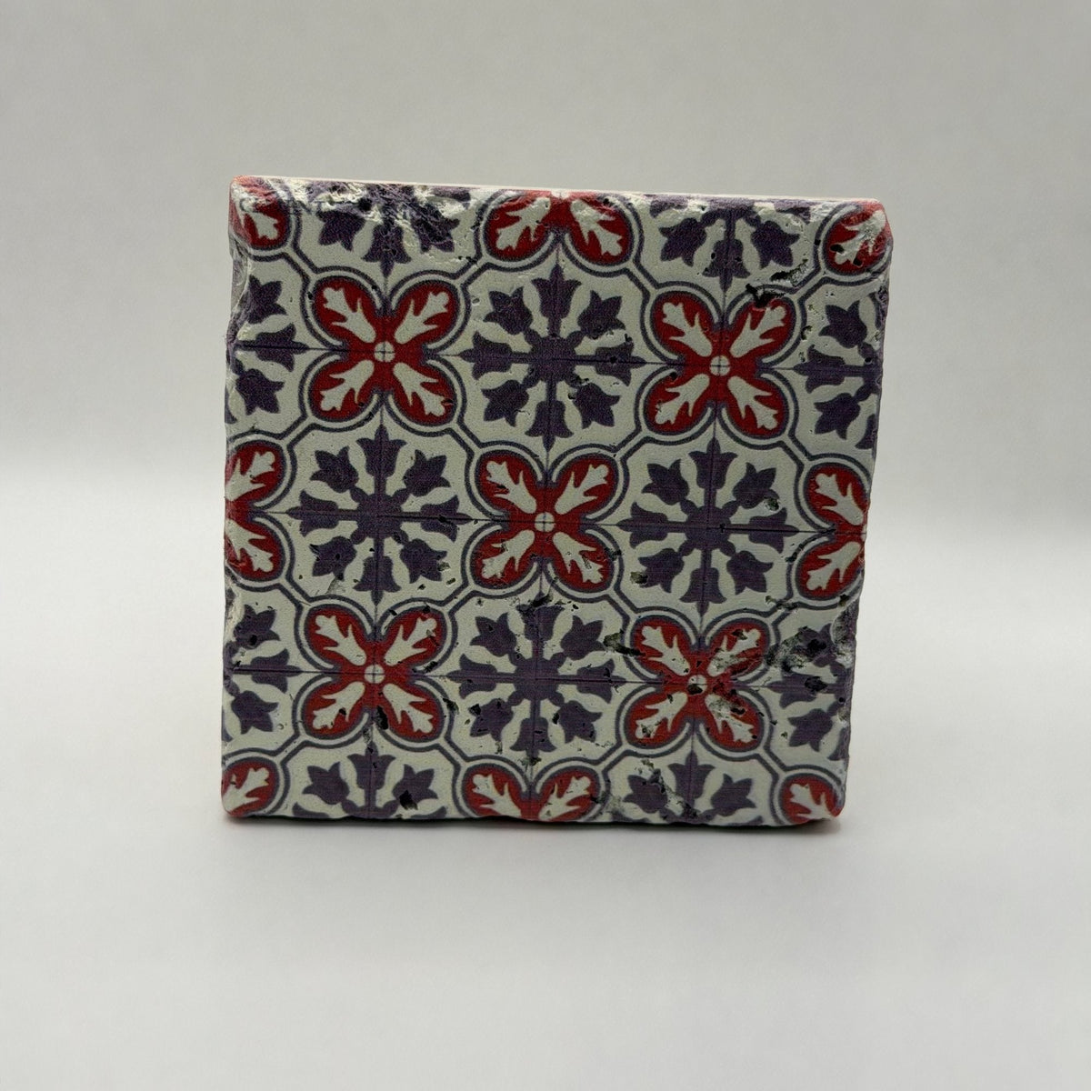 Ethnics pattern number 39 printed on a natural travertine stone coaster