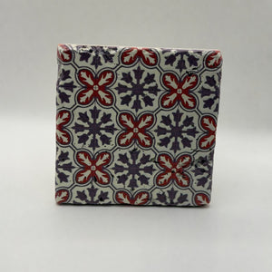 Ethnics pattern number 39 printed on a natural travertine stone coaster