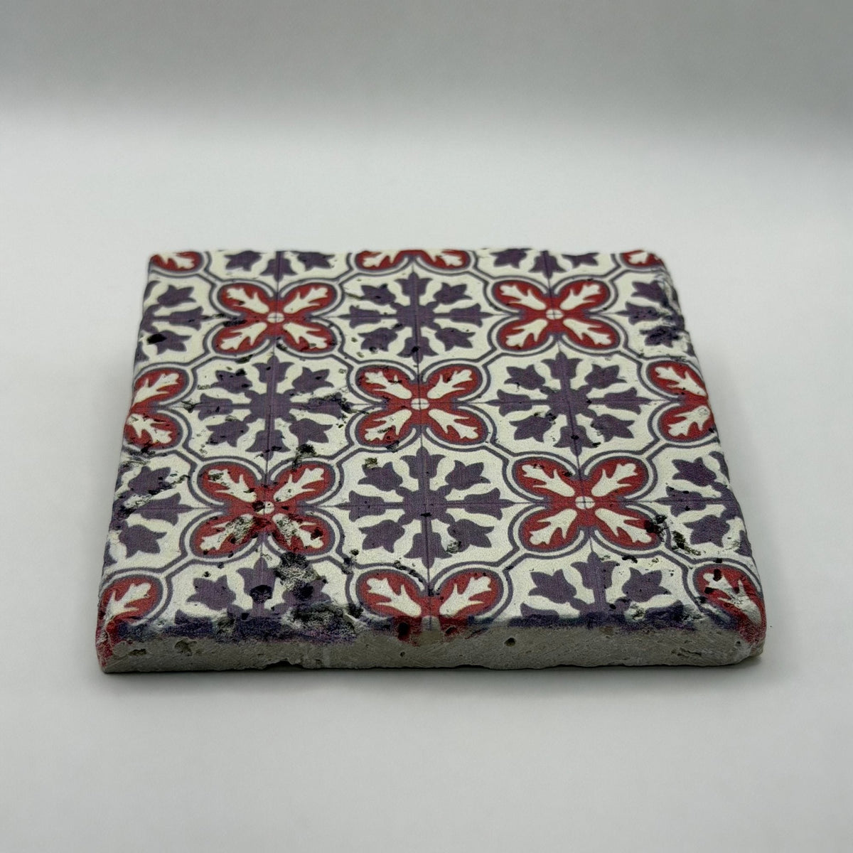 Ethnics pattern number 39 printed on a natural travertine stone coaster