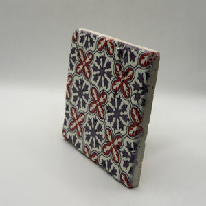 Ethnics pattern number 39 printed on a natural travertine stone coaster