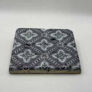 Ethnics pattern number 40 printed on a natural travertine stone coaster