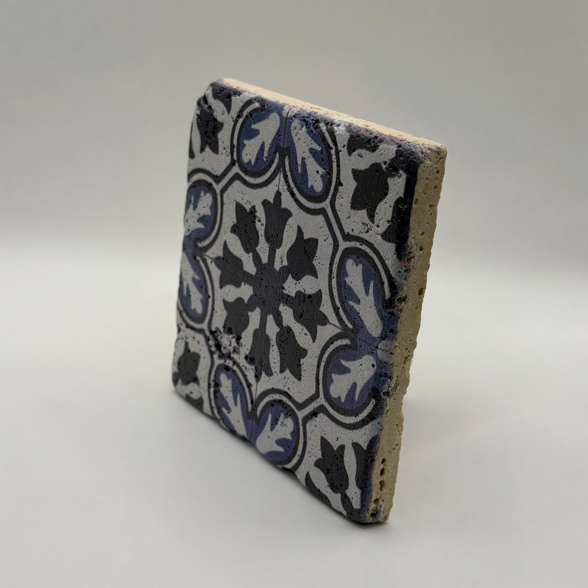 Ethnics pattern number 42 printed on a natural travertine stone coaster
