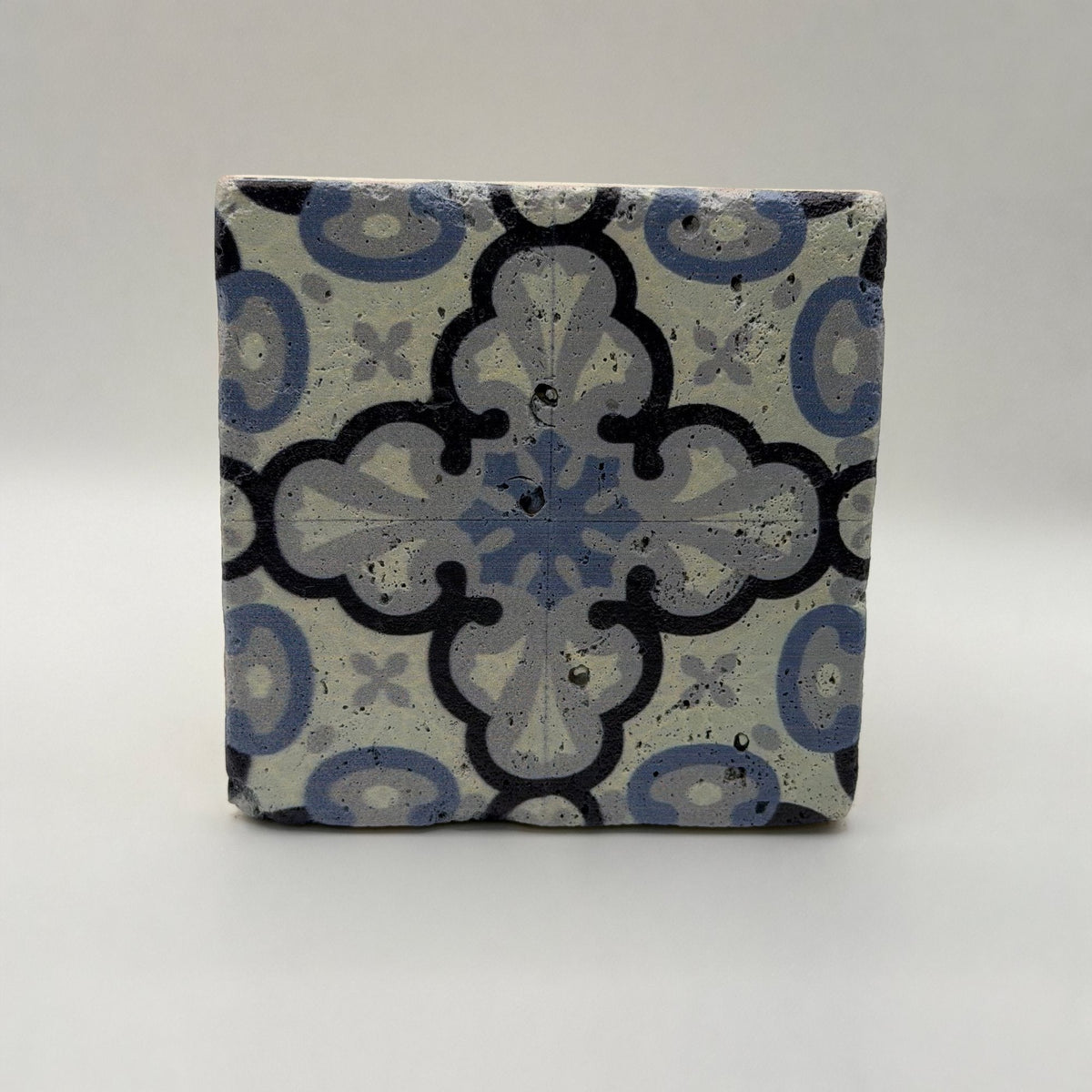 Ethnics pattern number 43 printed on a natural travertine stone coaster