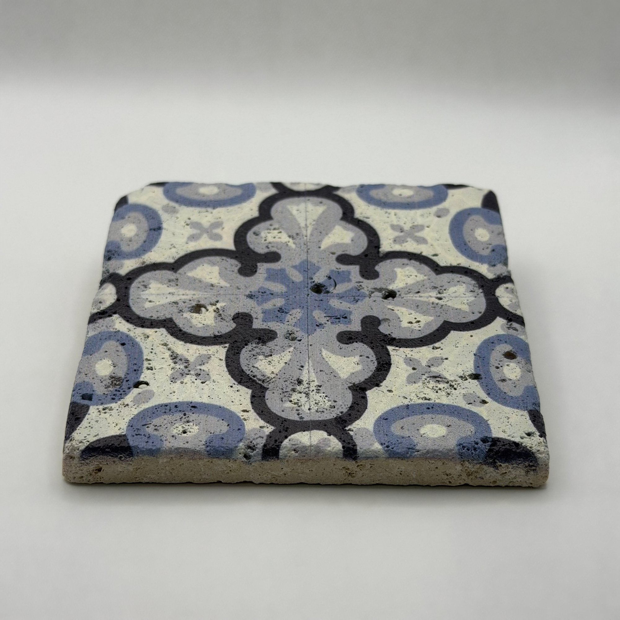 Ethnics pattern number 43 printed on a natural travertine stone coaster