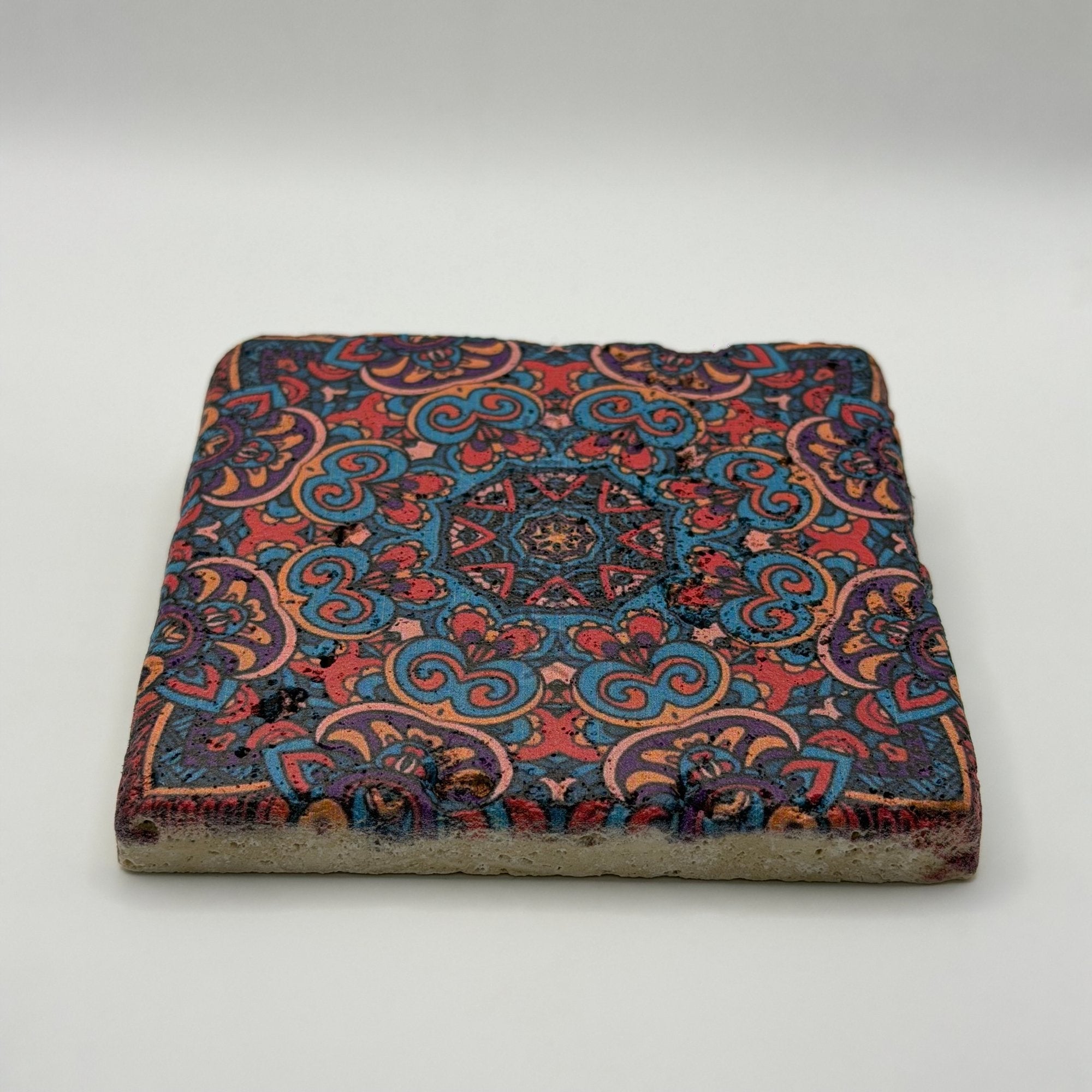 Ethnics pattern number 45 printed on a natural travertine stone coaster