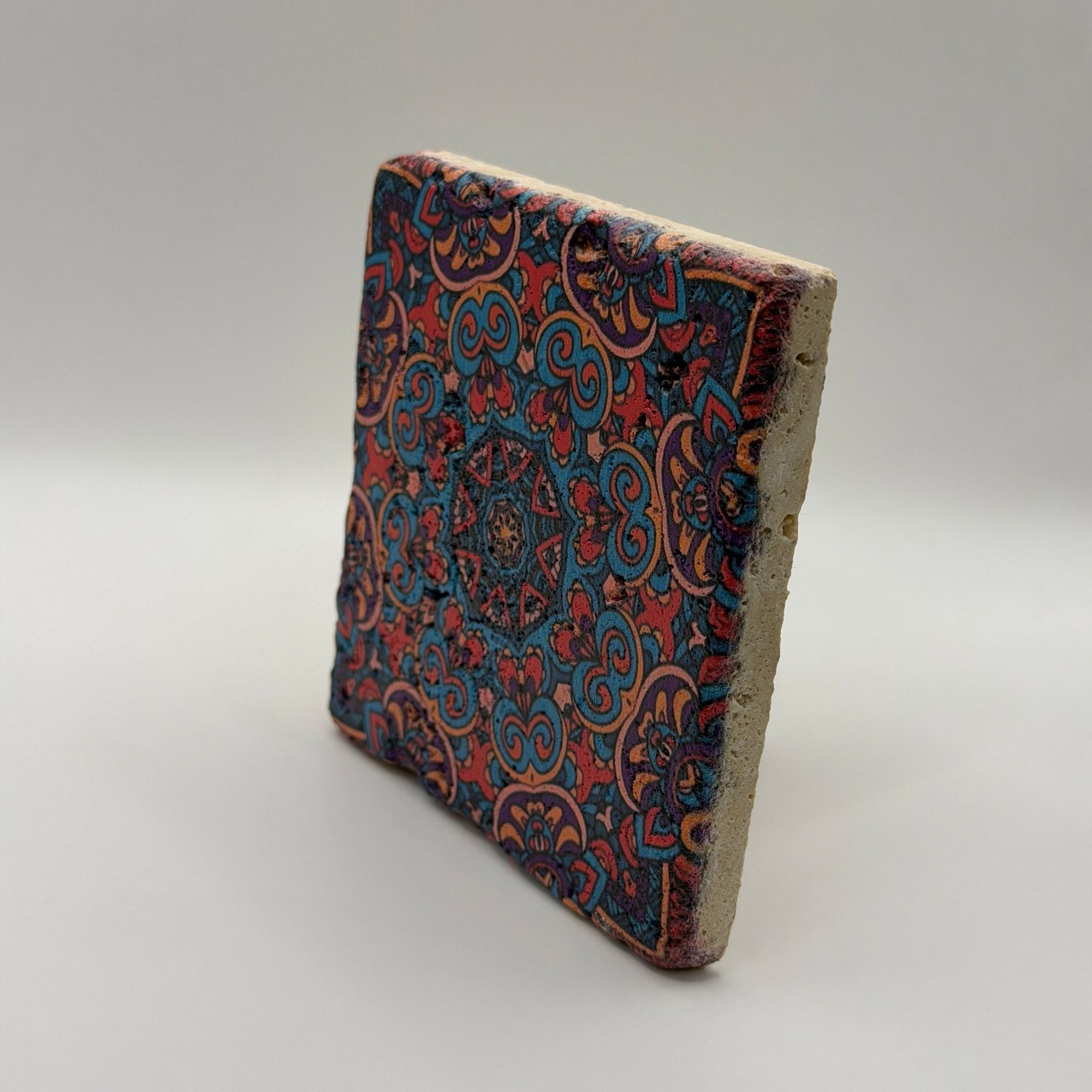Ethnics pattern number 45 printed on a natural travertine stone coaster